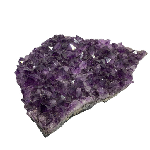 Kindred Crystal Collective — Amethyst Cluster, large deep purple raw amethyst crystal cluster on white background