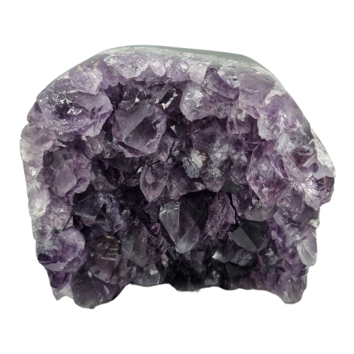 Amethyst free standing cluster close-up showing rich purple amethyst points catching the light, a timeless healing crystal for calm, focus and sacred spaces