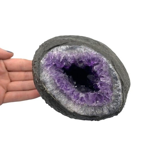 Kindred Crystal Collective — Amethyst Geode, angled view of natural amethyst geode highlighting crystal depth and colour variation within the geode cavity