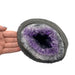 Kindred Crystal Collective — Amethyst Geode, angled view of natural amethyst geode highlighting crystal depth and colour variation within the geode cavity