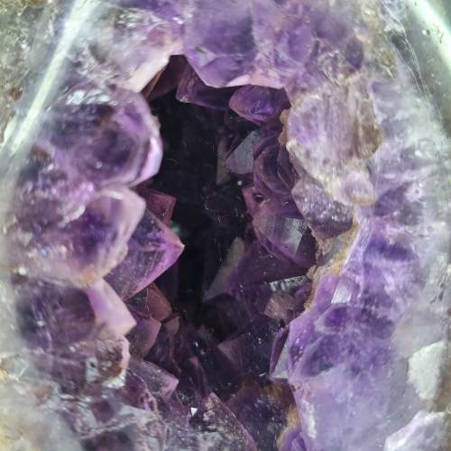 Kindred Crystal Collective — Amethyst Geode Egg, close-up detail of natural amethyst druzy crystal points inside polished geode egg cavity, 12.8x7cm