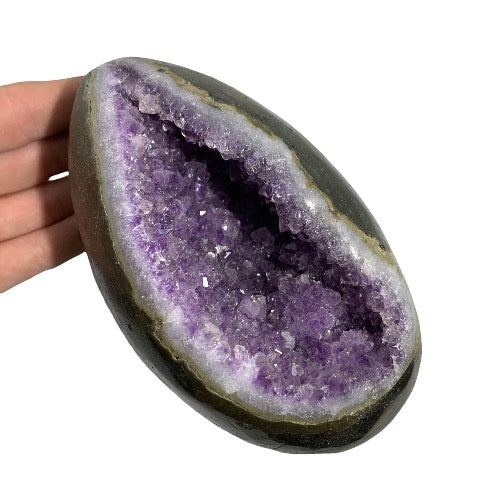 Kindred Crystal Collective — Amethyst Geode Egg, natural amethyst geode in egg form with polished outer shell and deep violet druzy crystal interior, 14.9cm tall