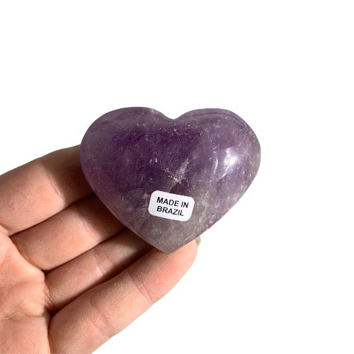 Kindred Crystal Collective — Amethyst Heart, polished medium purple amethyst heart from Brazil, size reference held in open palm, white background