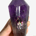 Kindred Crystal Collective — Amethyst Point, close-up of deep violet amethyst crystal tip with natural rainbow iridescence and internal inclusions visible