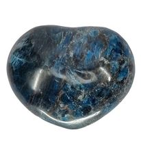 Apatite crystal heart close-up showing rich oceanic blue tones, a healing crystal for forward movement and authentic expression