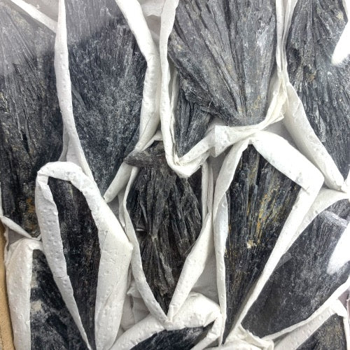 Kindred Crystal Collective — Black Kyanite Rough Boxed, close-up detail of striated black kyanite blades and natural raw surface texture