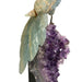 Kindred Crystal Collective — Blue Onyx Parrot on Amethyst Cluster, side view showing carved wing and tail feather detail on amethyst column