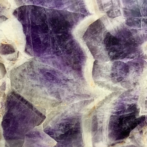 Kindred Crystal Collective — Chevron Amethyst Slab, close-up of deep purple and white chevron banding pattern on polished amethyst surface