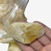 Kindred Crystal Collective — Citrine Rough 1KG Light, pale golden raw citrine chunks spilling from a clear bag on white background.