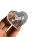 Kindred Crystal Collective — Clear Quartz Heart Brazil, medium polished transparent clear quartz heart with natural inclusions, size reference held in hand