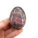 Cobaltian calcite egg close-up showing striking vivid pink colouring, a rare uplifting crystal for creativity, harmony and deep meditation