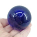 Kindred Crystal Collective — Dark Blue Obsidian Sphere, polished deep blue glass sphere, size reference with hand