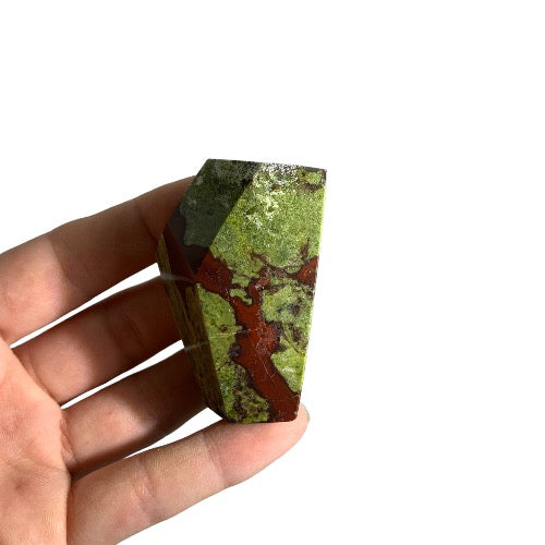 Kindred Crystal Collective — Dragon Blood Jasper Free Form, small polished green and red dragon blood jasper freeform, size reference with hand
