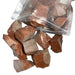 Kindred Crystal Collective — Goldstone Rough 1KG, glittering orange-gold raw goldstone chunks spilling from a clear bag on white background.