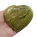 Green opal heart close-up showing natural green tones and smooth polished finish, a nourishing healing crystal for grief, renewal and prosperity