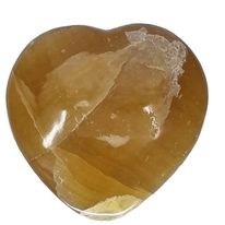 Natural honey calcite carved crystal heart in warm golden amber, 173g, for confidence, clarity and steady direction