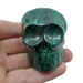 Large malachite crystal skull 278g with deep emerald green swirling formations, a one-of-a-kind collector's piece for spiritual transformation