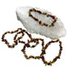 Kindred Crystal Collective — Mookaite Chip Bracelets (Pack of 5), irregular polished stone chips in earthy burgundy, mustard yellow, brown and cream tones.
