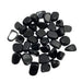 Kindred Crystal Collective — Black Obsidian Tumbled 1.5–2cm, large pile of small polished jet black volcanic glass stones with mirror-like glassy finish on white background