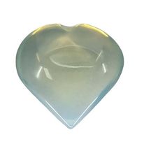 Opalite heart close-up showing ethereal sky-blue shimmer and rainbow glow, a man-made synthetic glass crystal heart for hope and optimism