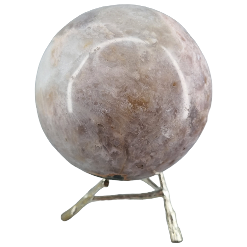 Pink amethyst sphere close-up showing natural blush pink tones and druzy crystal formations, a rare Patagonian crystal statement piece for love and empowerment