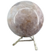 Pink amethyst sphere close-up showing natural blush pink tones and druzy crystal formations, a rare Patagonian crystal statement piece for love and empowerment