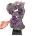 Kindred Crystal Collective — Polished Amethyst Cluster, large sculptural purple amethyst cluster on black metal stand, size reference with hand