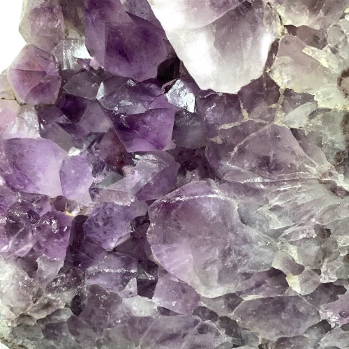 Kindred Crystal Collective — Polished Amethyst Cluster, close-up of dense purple amethyst crystal points on lower section of cluster
