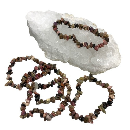Kindred Crystal Collective — Rhodonite Chip Bracelet (Pack of 5), five mixed pink and dark stone chip bracelets arranged around a white crystal cluster on a white background.
