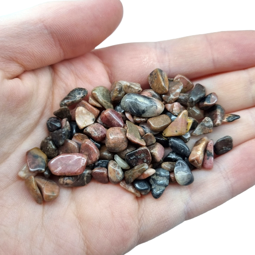 Kindred Crystal Collective — Rhodonite Chips 500g, a pile of polished dusty pink, brown and black stone chips