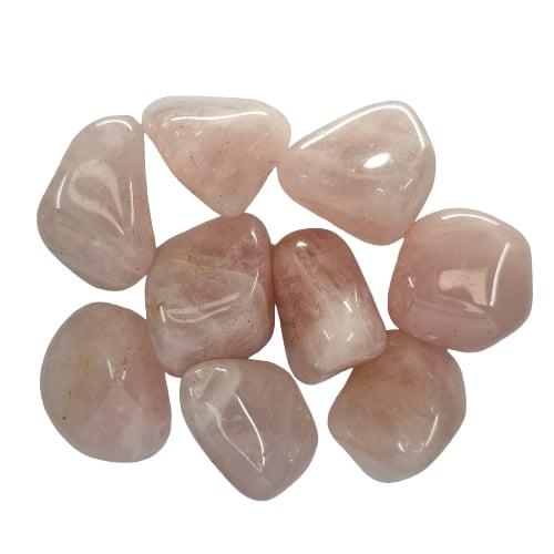 Kindred Crystal Collective — Rose Quartz Tumbled 2.5–3cm, nine polished soft blush to pale pink quartz stones with smooth waxy lustre on white background