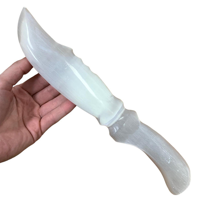 Natural selenite serrated wand 360g with jagged sword edge and soft white glow, for cord cutting, energy cleansing and spiritual clarity