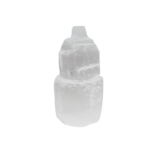 Small selenite tower showing luminous moonlike glow and natural striations, an affordable healing crystal for mental calm and meditation