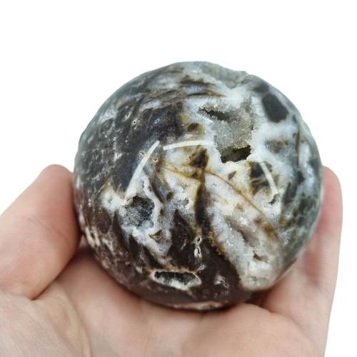 Kindred Crystal Collective — Sphalerite Sphere, side view of natural sphalerite polished sphere showing glassy lustre and warm brown translucent tones