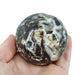 Kindred Crystal Collective — Sphalerite Sphere, side view of natural sphalerite polished sphere showing glassy lustre and warm brown translucent tones