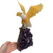 Kindred Crystal Collective — Yellow and White Calcite Eagle, hand-carved crystal eagle on amethyst cluster base, size reference with hand