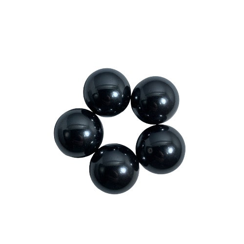 Kindred Crystal Collective — Magnetic Hematite Round Pack 2cm, five perfectly spherical jet black magnetic hematite rounds with mirror-like metallic finish on white backgroun