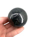 Nephrite jade sphere close-up showing rich green tones and smooth polished surface, a timeless auspicious crystal for feng shui, protection and prosperity
