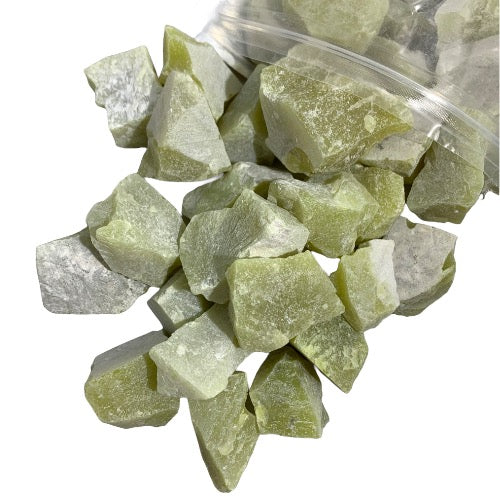 Kindred Crystal Collective — Oil Jade Rough 1KG, pale green raw jade chunks spilling from a clear bag on white background